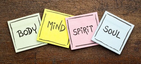 Four sticky notes saying "Body, Mind, Spirit, Soul."