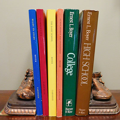 Books on a bronze bookends in a shape of two feet