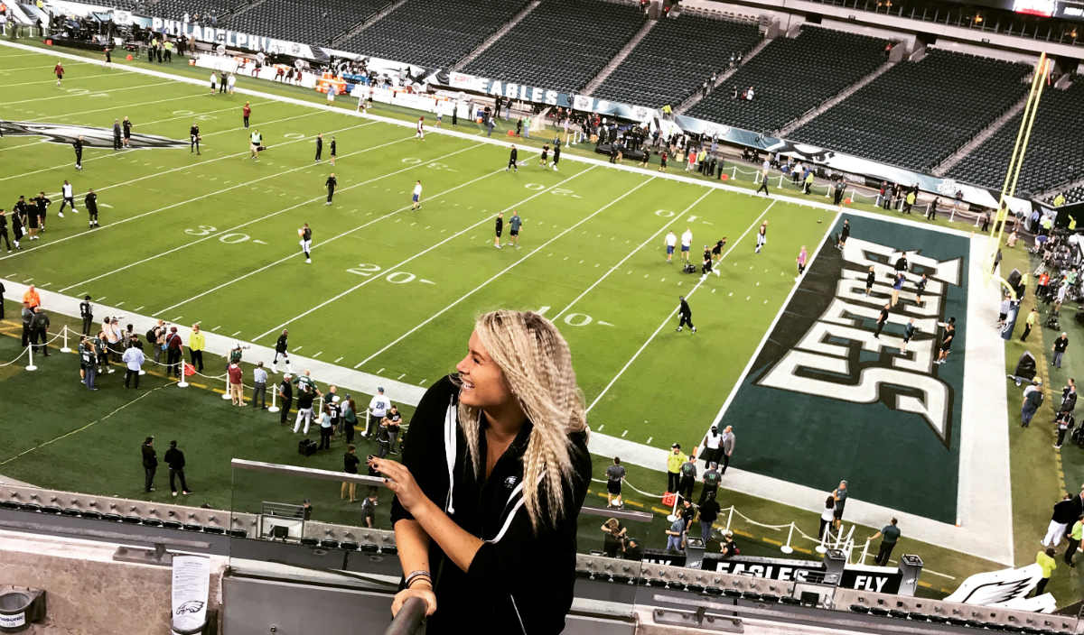 Alumna Bre Grignano working at the Philadelphia Eagles game.