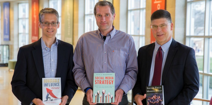 Photo of David Hagenbuch, Ketih Quesenberry, and Michael Zigarelli holding their published books.