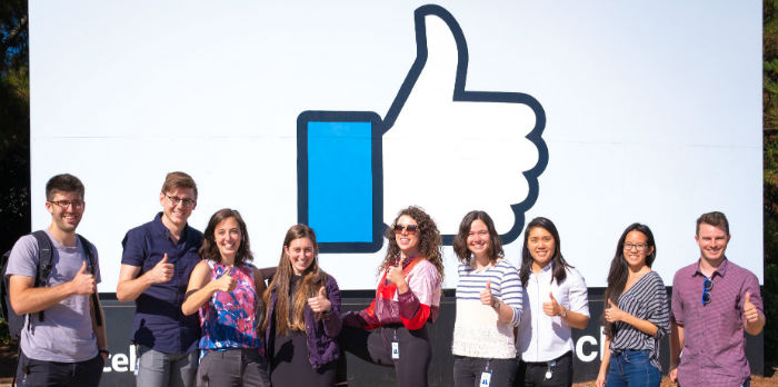 Group of people outside of the Facebook building.