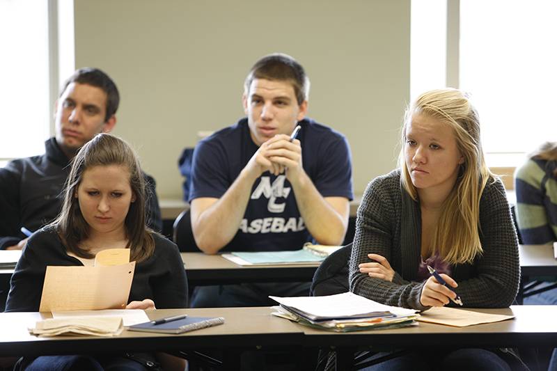 Students listening to the lecture in the classroom.