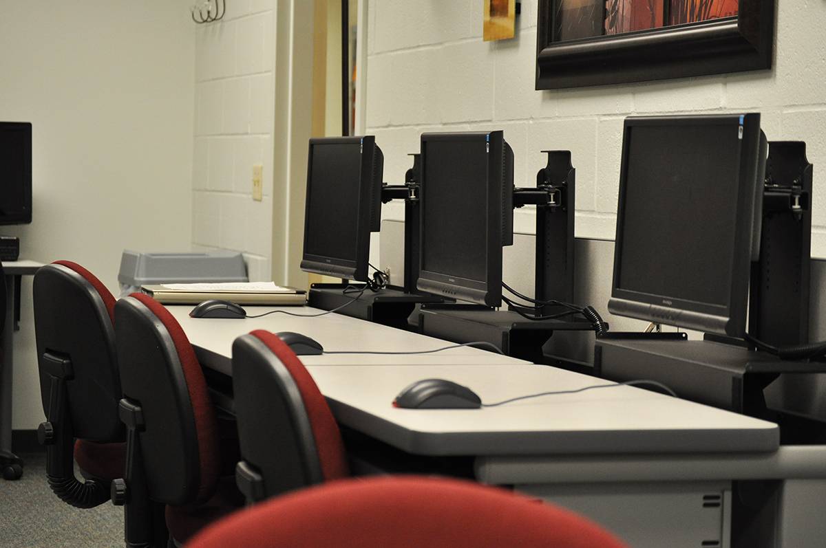 Three computers in the resource room.