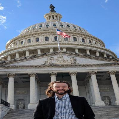 Galen standing in front of the capital building