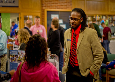 Student talking with Admissions officer.