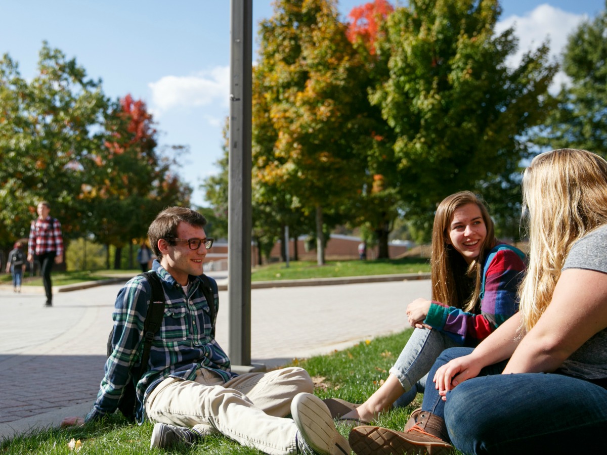 students sitting outside