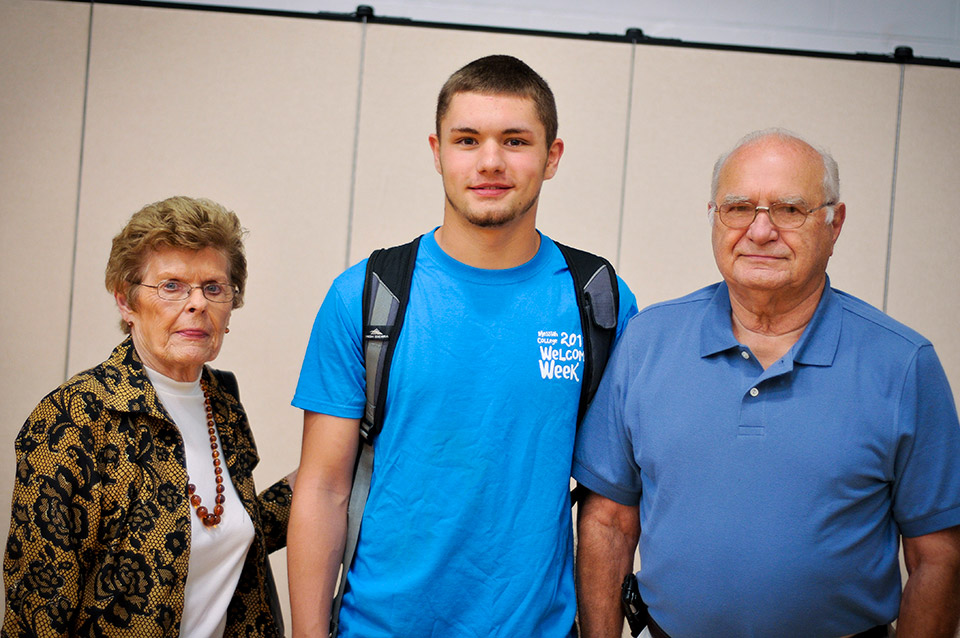 Student with his grandparents during grandparents day.
