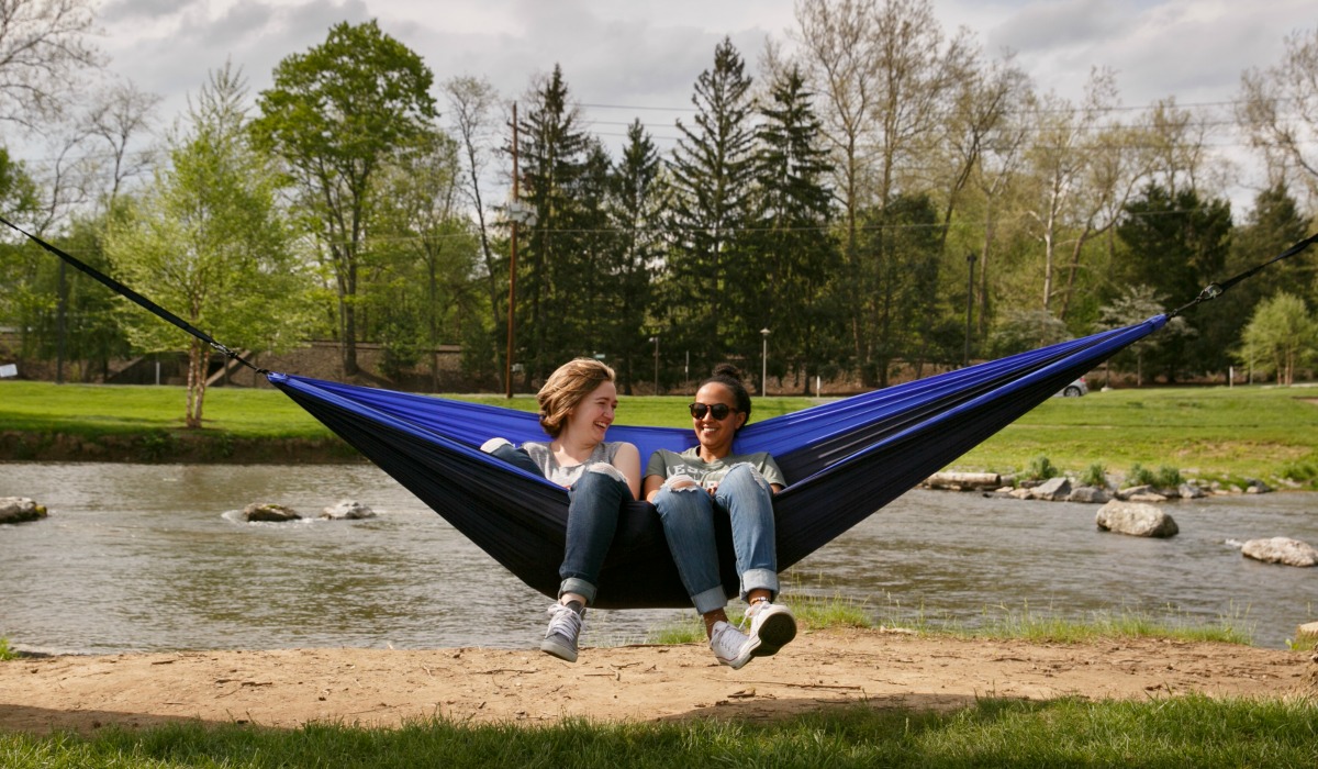 Students on a hammock by the Yellow Breeches