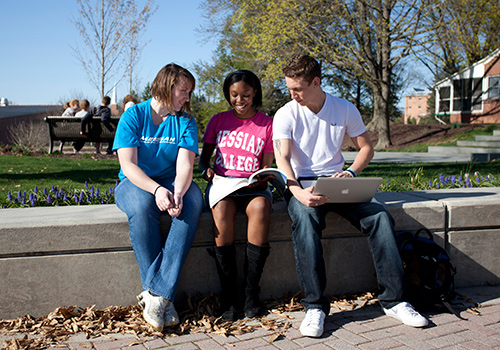 Students sitting outside talking