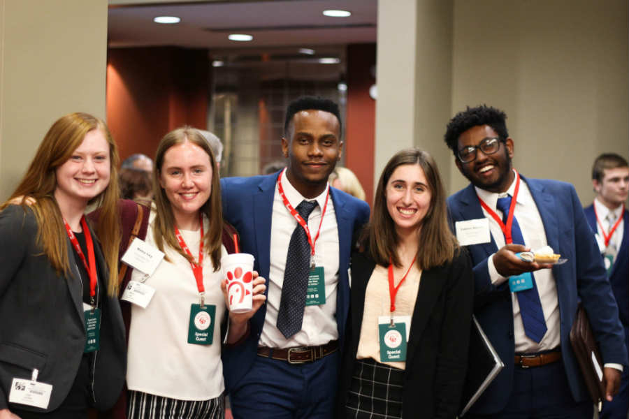 five students in professional attire attend a networking lunch at Chick-Fil_A