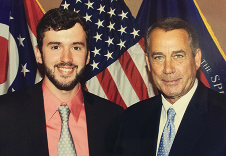 Johnathan Hershey and John Boehner standing in front of the American flag