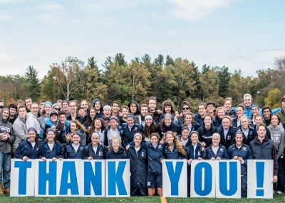 Women's sports team with Thank You sign.