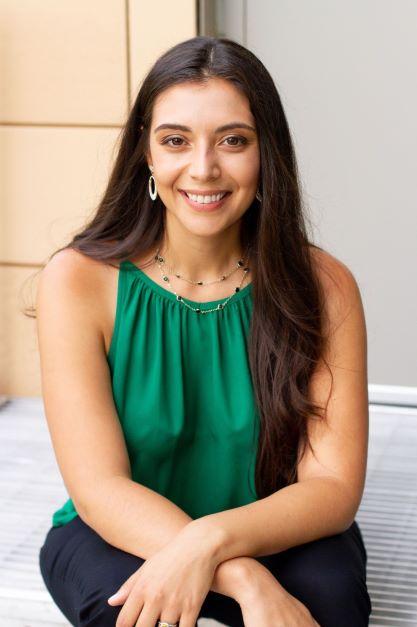 Head shot of Luiza Cliver sitting down with her arms crossed