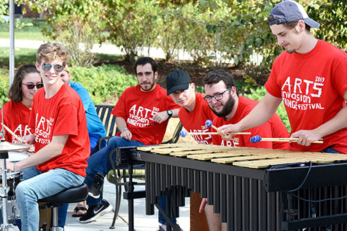 Messiah College students playing at the Arts Invasion day