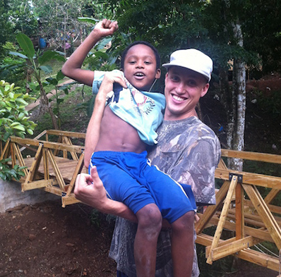 Russell Woleslagle holding child friend in Panama