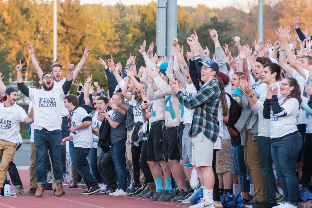 Students cheering at a soccer game