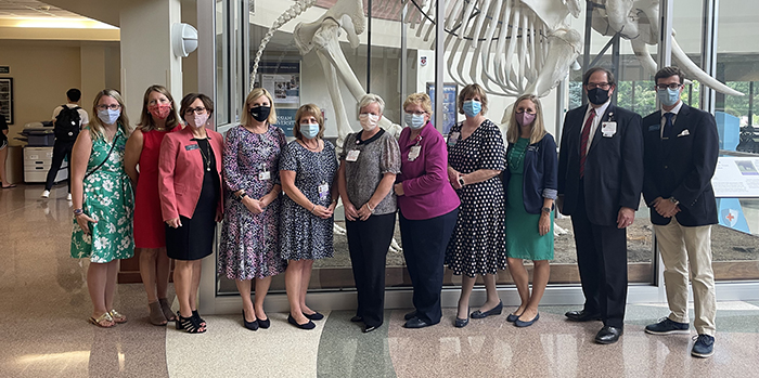 Messiah nursing professors and representatives from UPMC post for a photo in Jordan Hall lobby