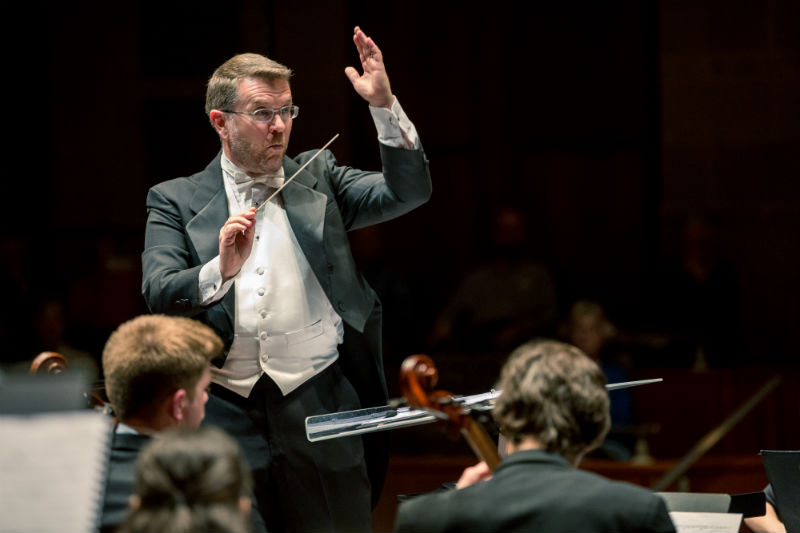 Timothy Dixon conducting an orchestra