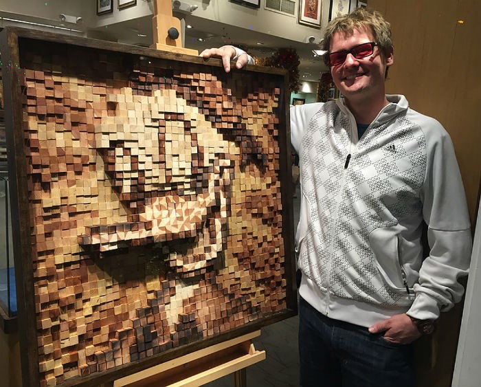 Alummnus, Tim McCloskey with his wooden art sculpture