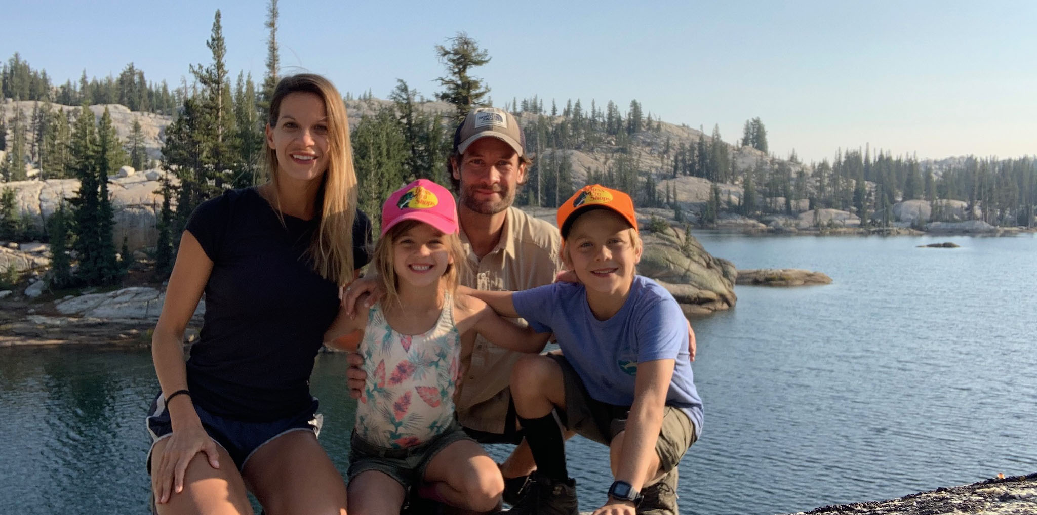 Tim Murphy is pictured with his wife and two kids in front of a lake.