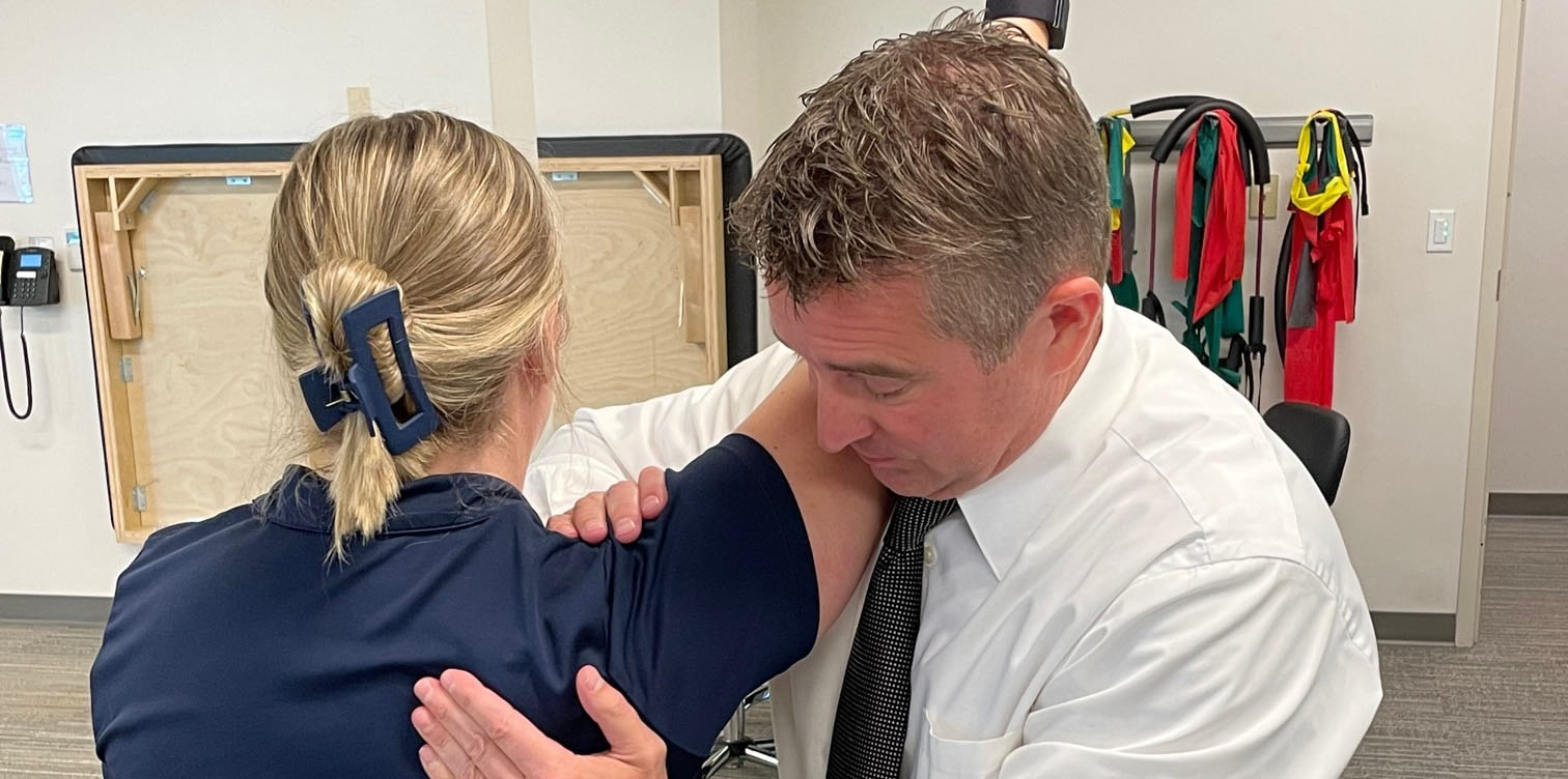 Physical therapist works on a patient in the clinic.