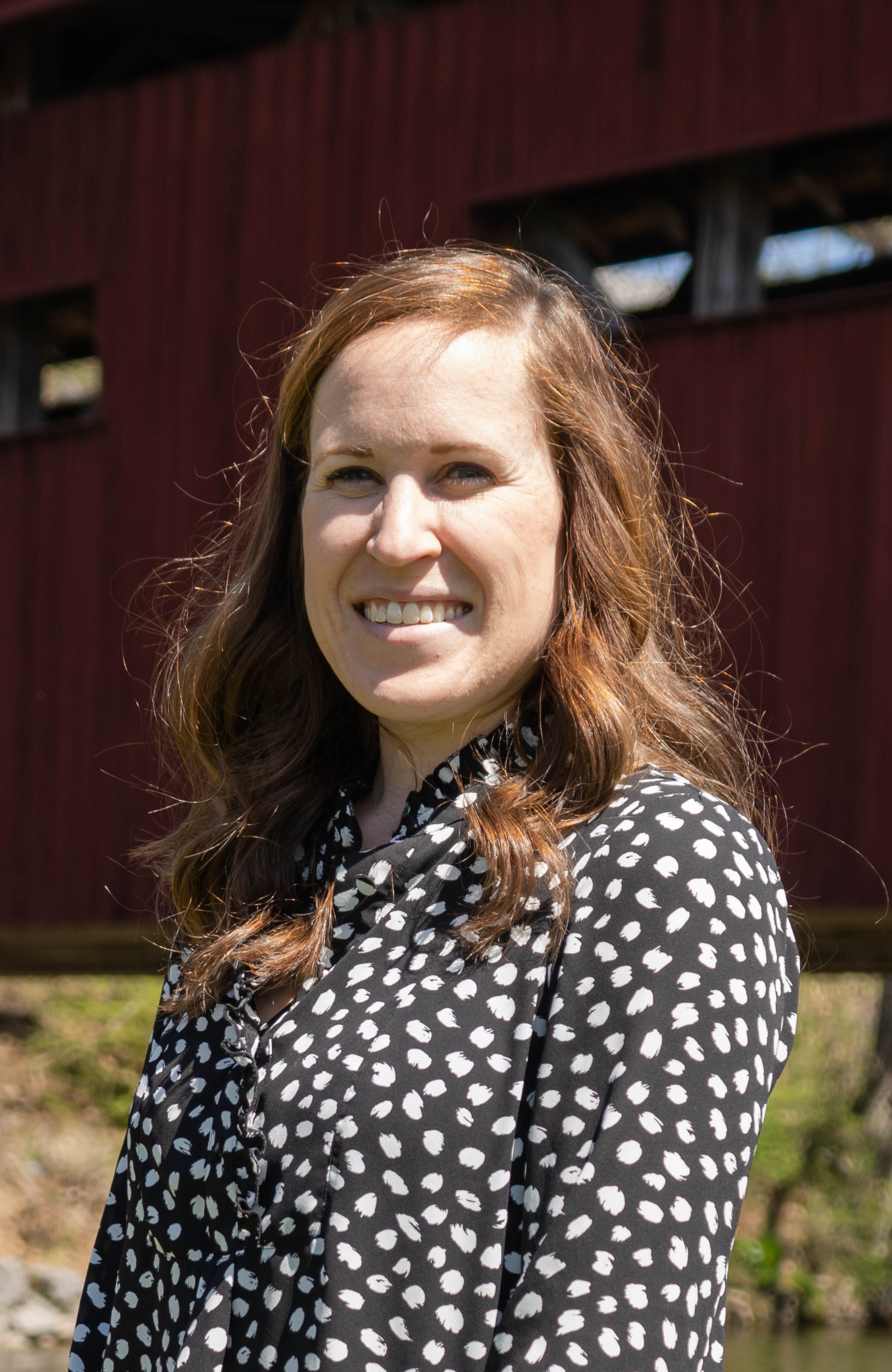 Young woman in polka dot shirt