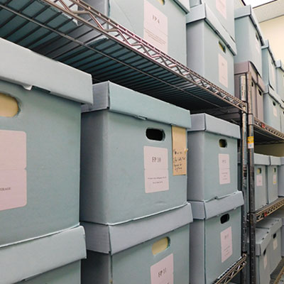 Boxes stacked in shelves at the Boyer Archives.
