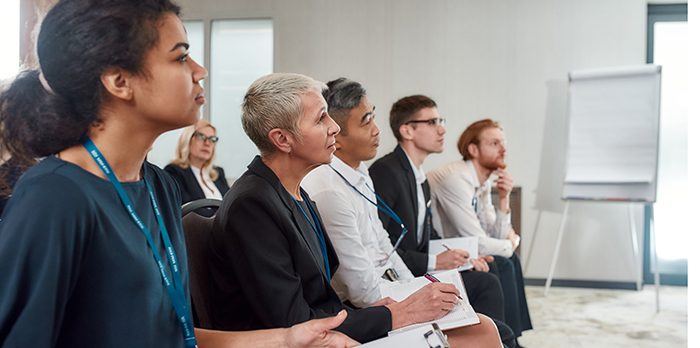 Professionals sit in a training