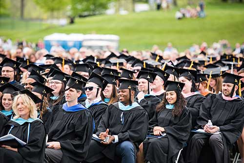 Graduating students wearing their caps and gowns during commencement 2016