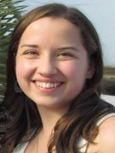 a smiling female student with shoulder length brown hair