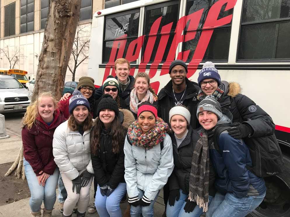 students posing on a sidewalk in NYC