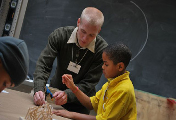 Education major student teaching a child.