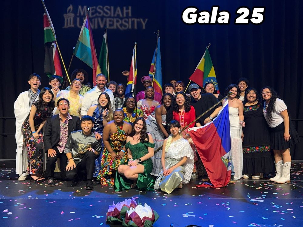 The manager of Union Cafe with international student workers at the international student gala