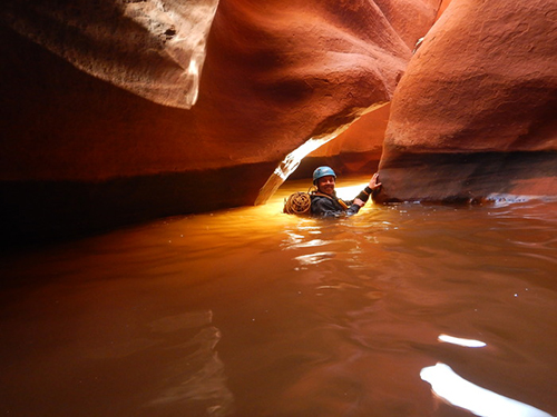 Laura Dahl in a cave filled with water.