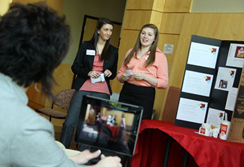 Management and business students making a presentation.