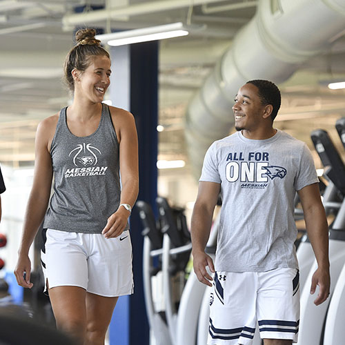 Students walking in fitness center