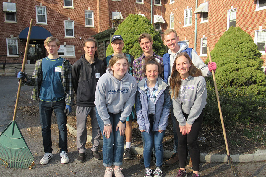 group of students stand in front of paxton ministries