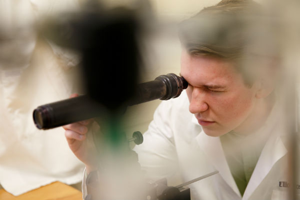 Student and microscope