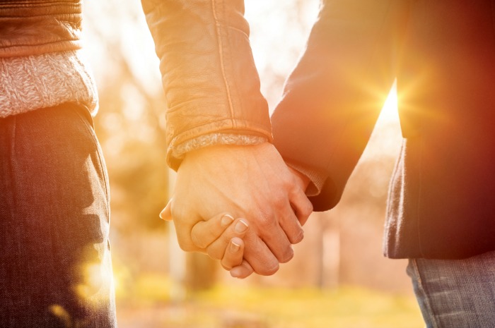 a couple holding hands