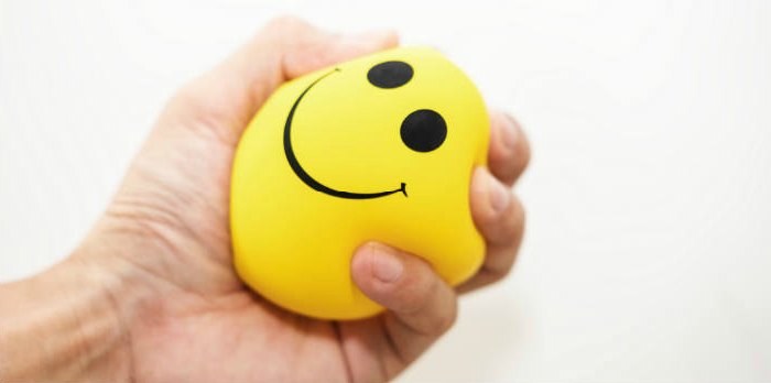 Stress ball being squished in someone's hand