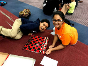 Kids playing checkers