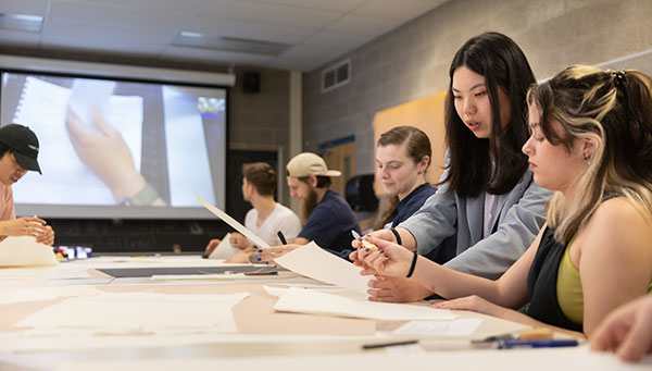 Students in classroom with female professor