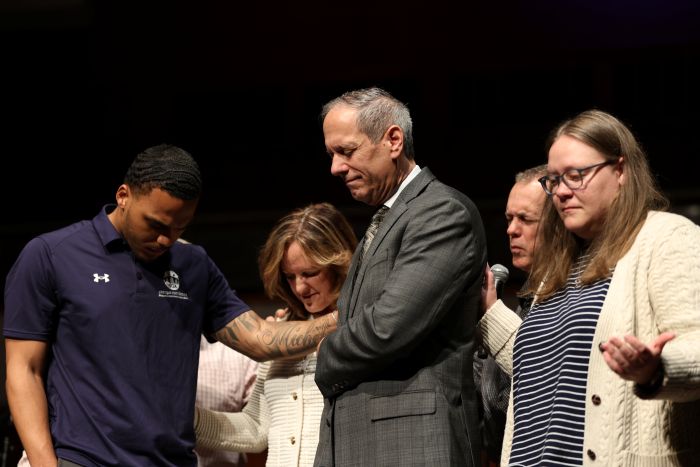 Jon and Shari praying together with Campus Ministries. 