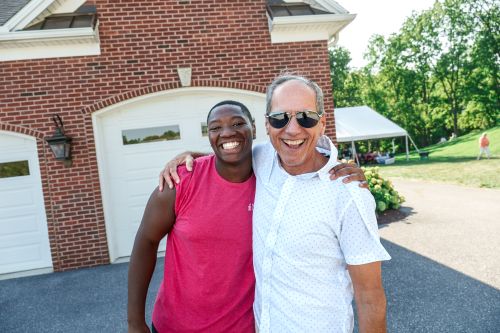 Jon and a student smiling at the MU picnic