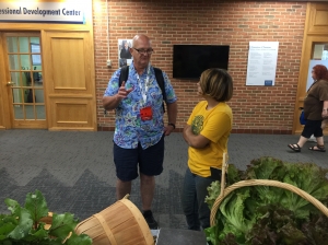 Dana talking with a customer during a farm stand