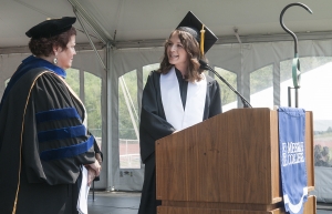 Sarabeth Ganung presents President Phipps with the senior class gift