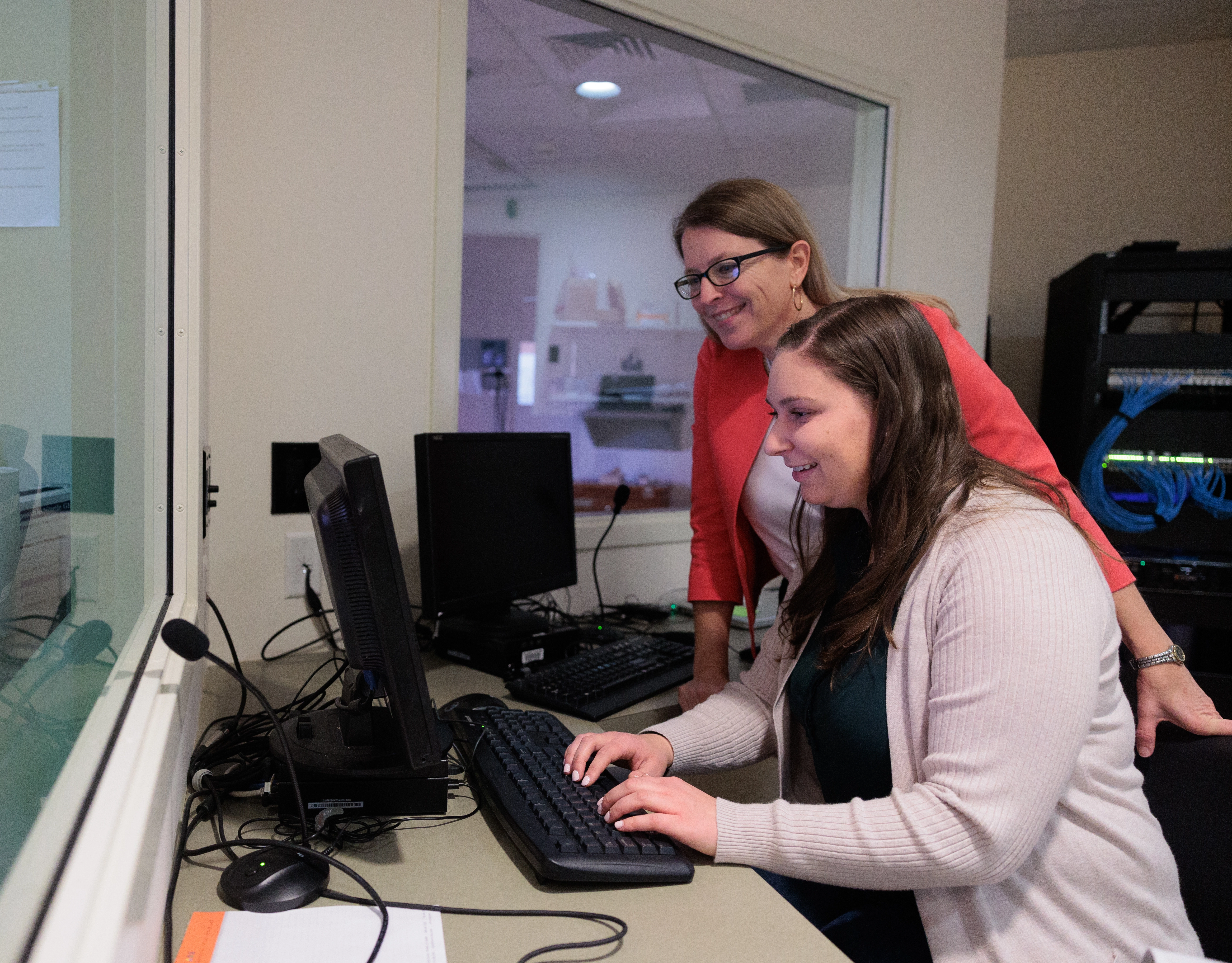 Brenda Elliott instructs a student in the nursing simulation lab
