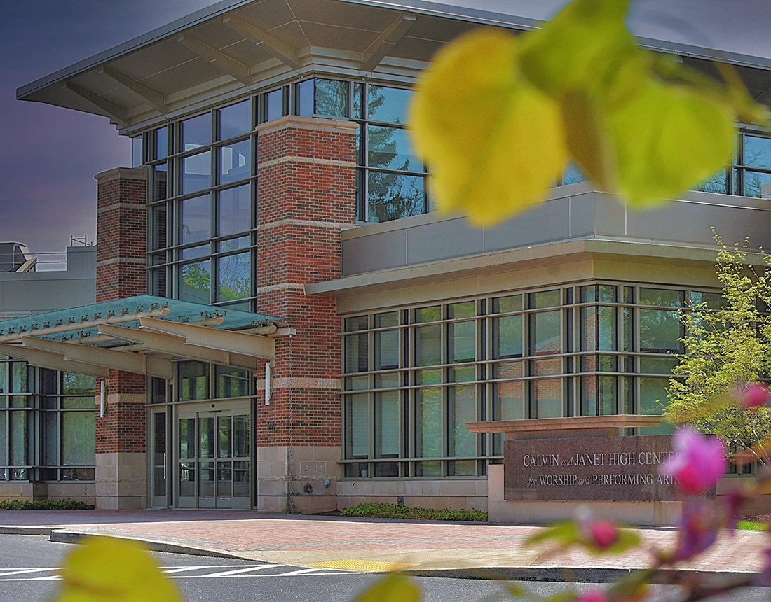 The High center building is pictured among pink flowers