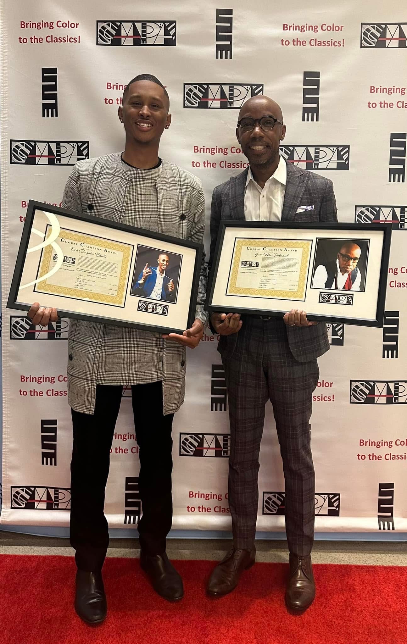 Banks and another male hold awards