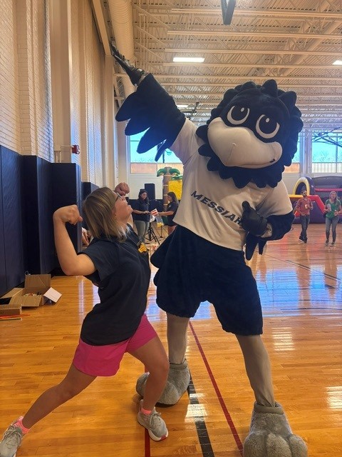 Student with mascot.